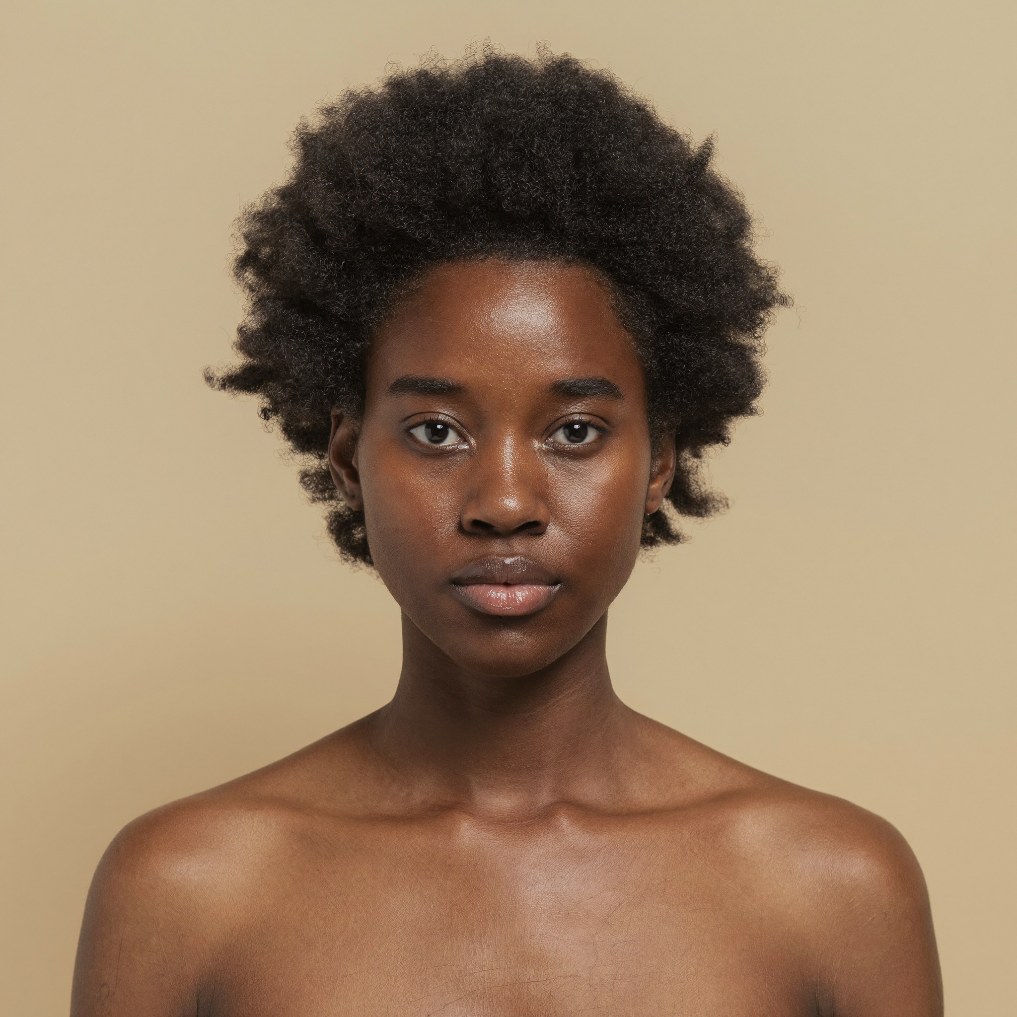 Young woman with natural afro hair, serene and naturally beautiful